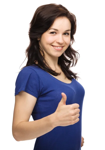 Žena ukazuje palcem nahoru gesto — Stock fotografie