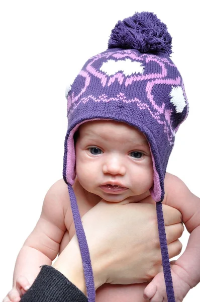 Portrait of newborn baby girl wearing violet winter hat — Stock Photo, Image