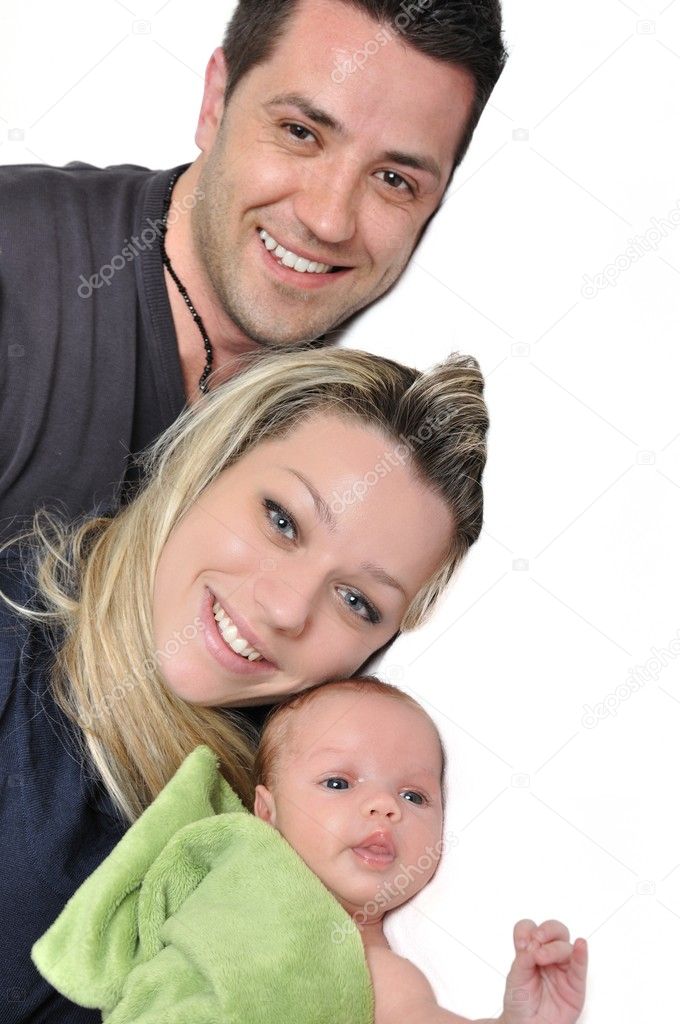 Portrait of a young happy family with the kid on a white backgro