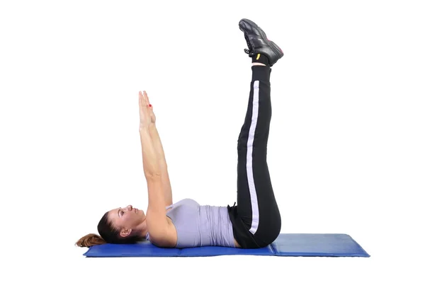 Fit young female pilates instructor showing different exercises — Stock Photo, Image