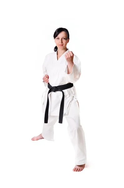 Karate kvinna poserar på en vit bakgrund — Stockfoto