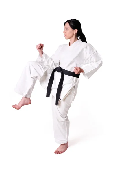 Karate mujer posando sobre un fondo blanco — Foto de Stock