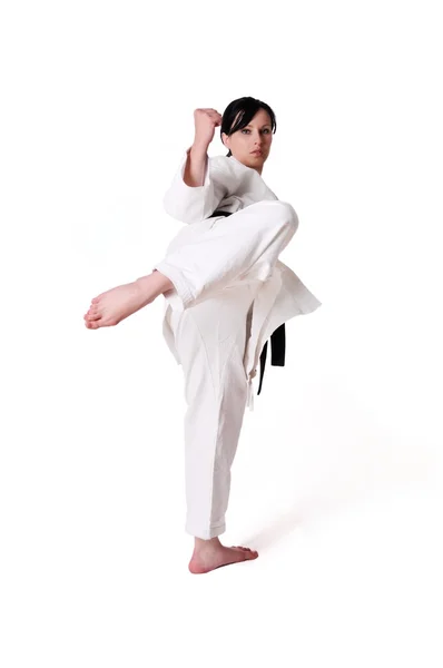 Karate kadın beyaz bir arka plan üzerinde poz — Stok fotoğraf