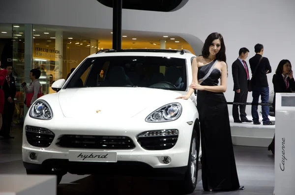 Unidentified model with Porsche Hybrid sport car — Stock Photo, Image