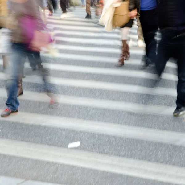 Crowd on zebra crossing street Royalty Free Stock Images