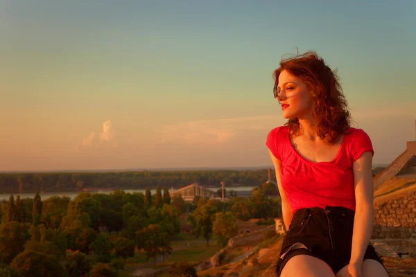 Girl at sunset — Stock Photo, Image