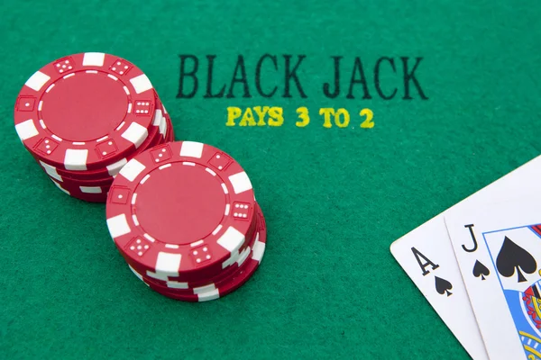 stock image Ace of spades and black jack with red poker chips in the backgro