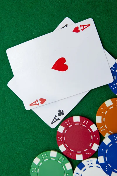 Texas holdem pocket aces on casino table with copy space and chi — Stock Photo, Image