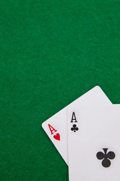 Texas holdem pocket aces on casino table with copy space — Stockfoto