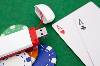 Texas holdem pocket aces on casino table with internet stick con clipart