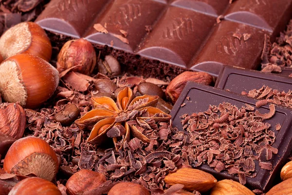 Tiles of different chocolate in the chocolate chips with nuts — Stock Photo, Image