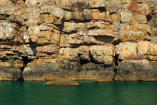 stock image The rocky coast of the island of Serpents (Ukraine) on the high