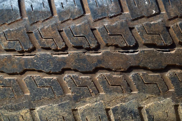 Pista de pneus sujos — Fotografia de Stock