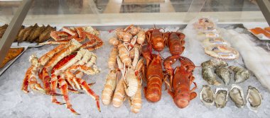 Crabs, scampi and shell fish for sale clipart