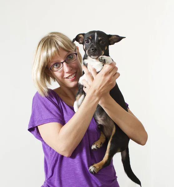 stock image Young woman with dog in studio