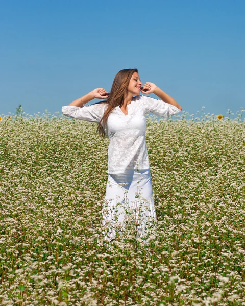Girl in buckwheat — Stock Photo, Image