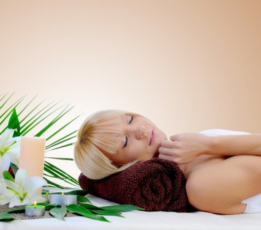 Young woman at spa procedure clipart