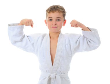 Young boy training karate. clipart