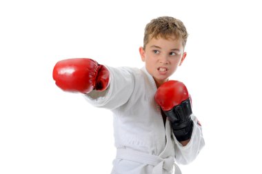 Young boy training karate. clipart