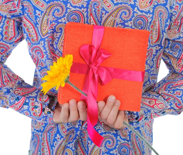 Man with a gift box and a flower — Stock Photo, Image