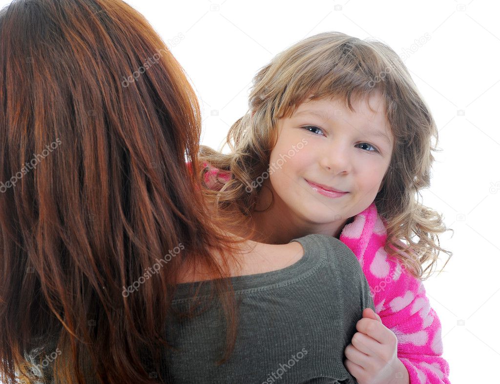 Cheerful girl hugs her young mother.