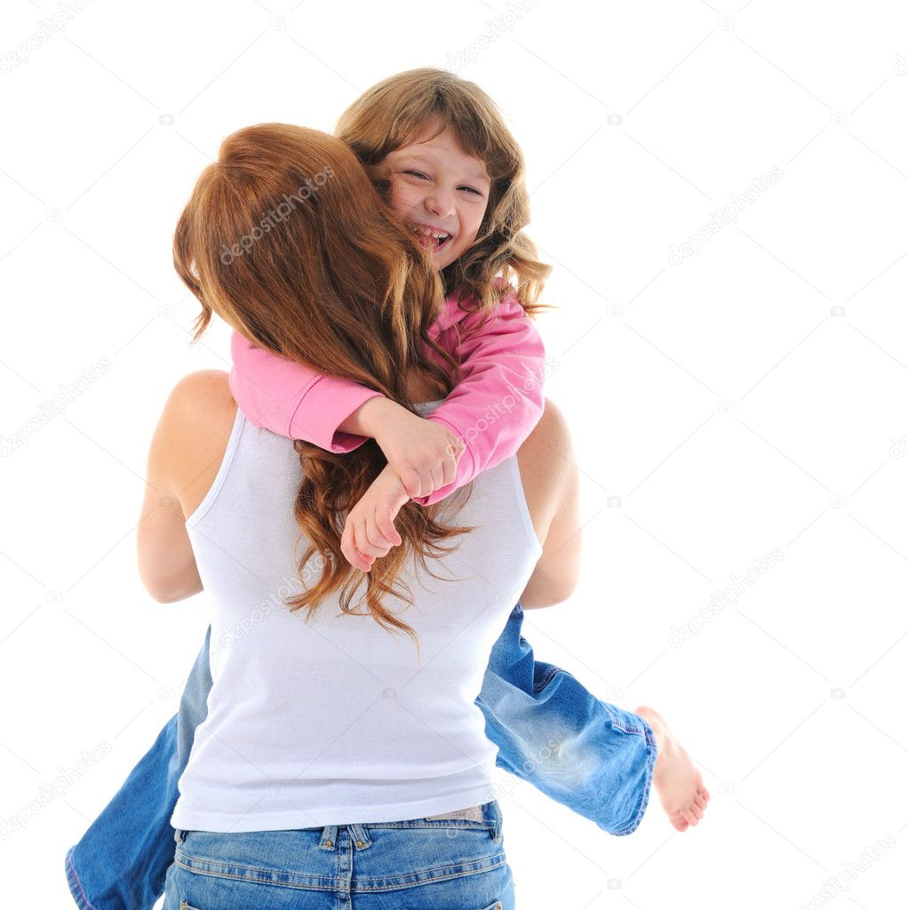 Cheerful girl hugs her young mother.
