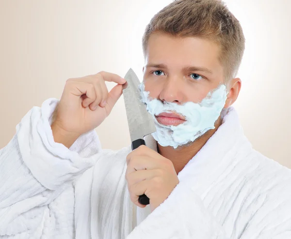 stock image Young man shaving