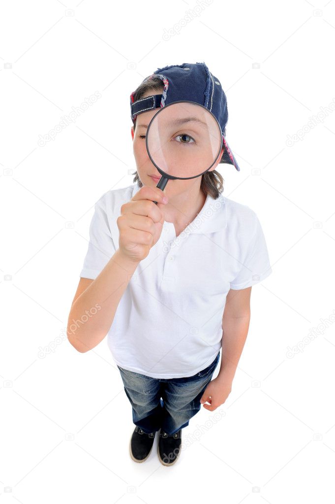 Boy looking through a magnifying glass