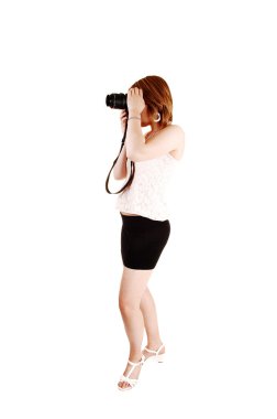 Girl taking pictures. clipart