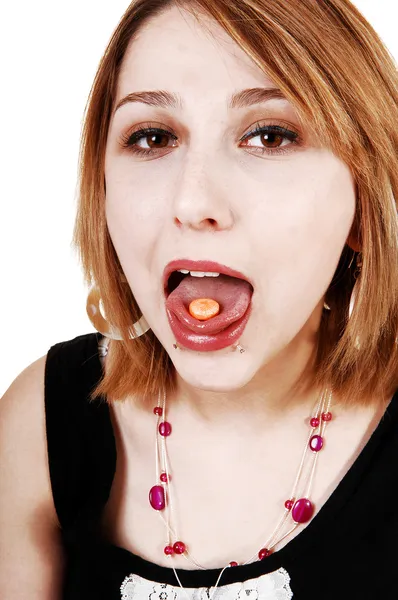Closeup of girl with pill. Stock Photo