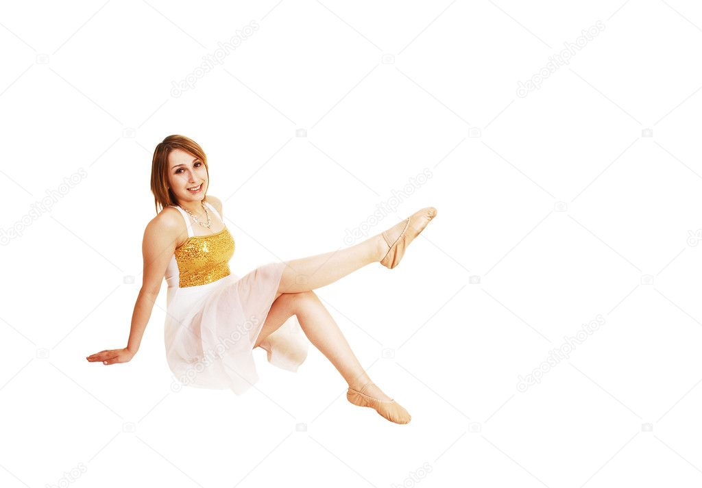 Ballerina sitting on floor.