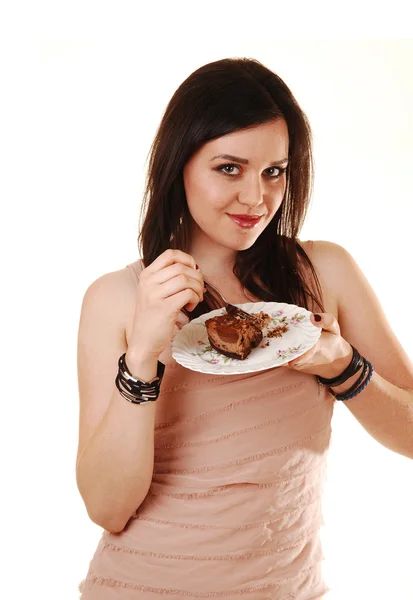 Girl eating chocolate cake. — Stock Photo, Image
