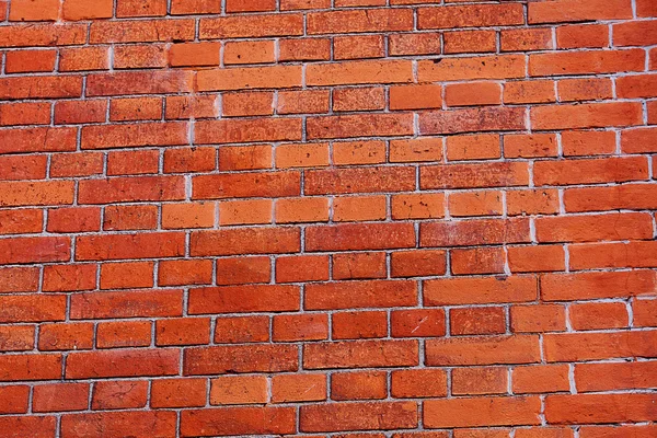 Fondo de una pared de ladrillo rojo — Foto de Stock