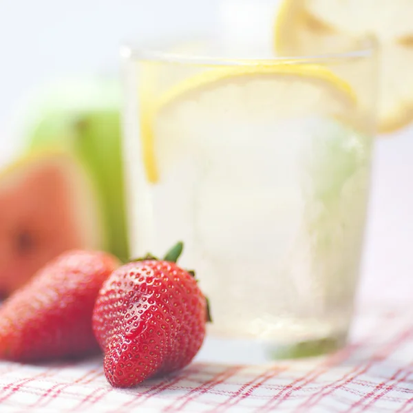 Cocktail with ice,lemon, fig,apple and strawberries — Stock Photo, Image