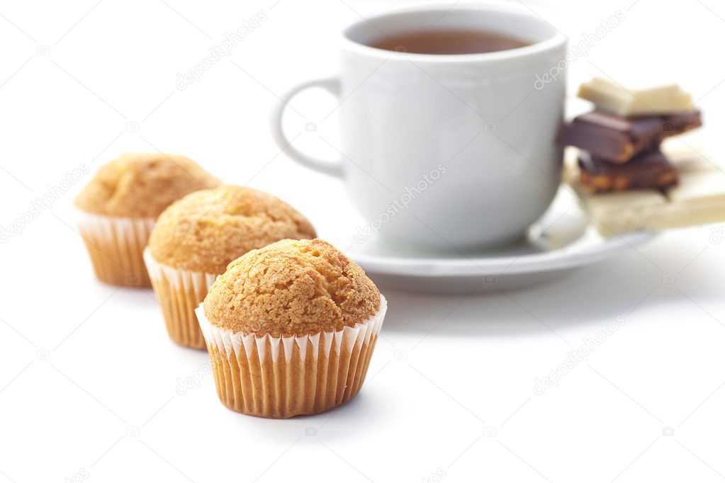 Bar of chocolate,tea and muffin isolated on white