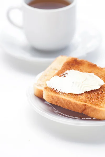 Té y tostadas con mantequilla aislada sobre blanco —  Fotos de Stock