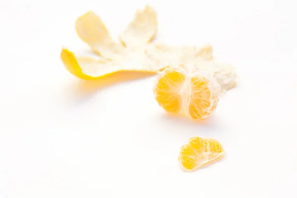 Tangerine and his skin on a white background — Stock Photo, Image
