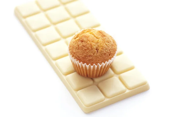Bar of white chocolate and muffin isolated on white — Stock Photo, Image
