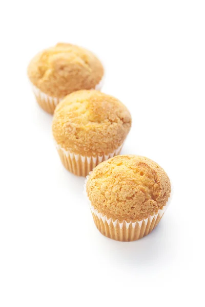 Tre muffin isolati su bianco — Foto Stock