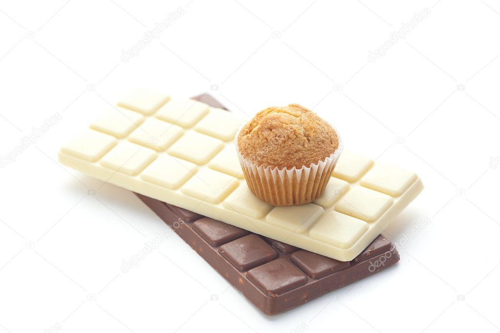 Bar of chocolate and muffin isolated on white