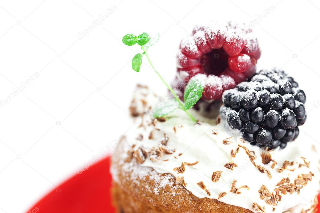 Muffin with whipped cream,mint, raspberries, blackberries and nu