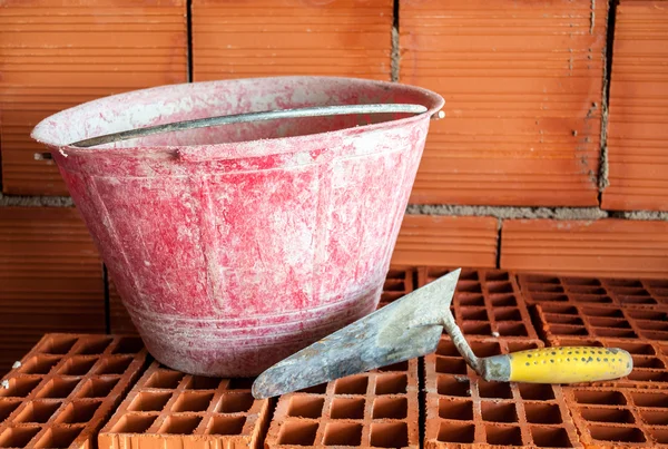 Trowel, bucket and bricks — Stock Photo, Image