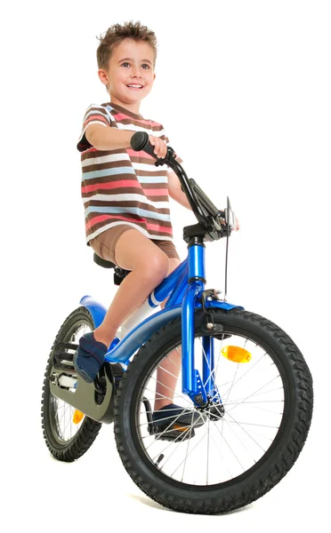 stock image Happy little boy on bike