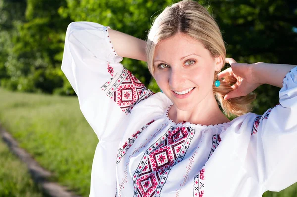 Happy ukrainian woman outdoors on the meadow — Stock Photo, Image