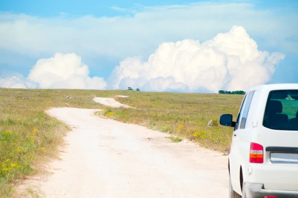 stock image Van on the dirt serpantine road