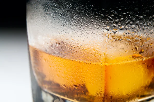Closeup macro misted glass of whiskey — Stock Photo, Image