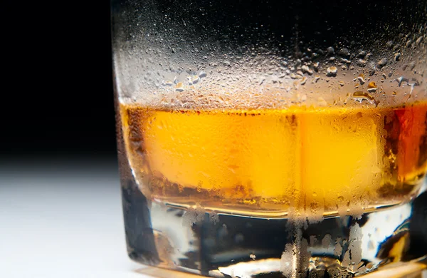 Closeup macro misted heavy glass of whiskey — Stock Photo, Image