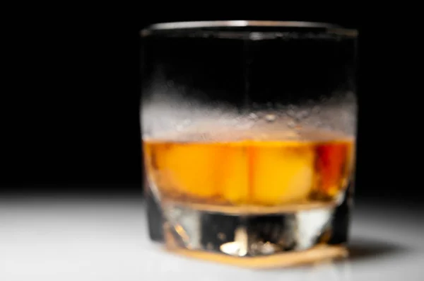 Closeup misted blurred glass of whiskey — Stock Photo, Image