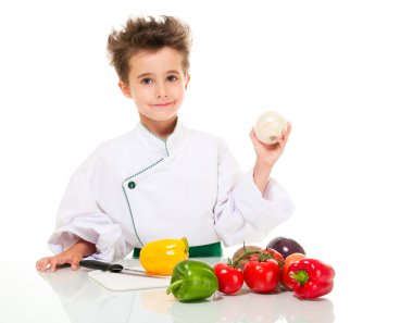 Little boy chef in uniform with knife cooking vegatables holding clipart