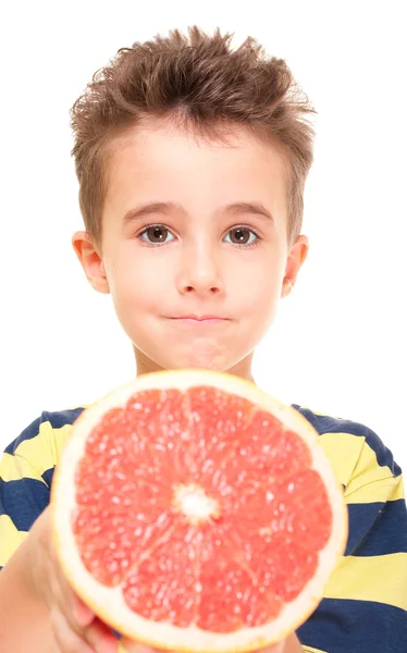 Lille dreng med grapefrugt - Stock-foto